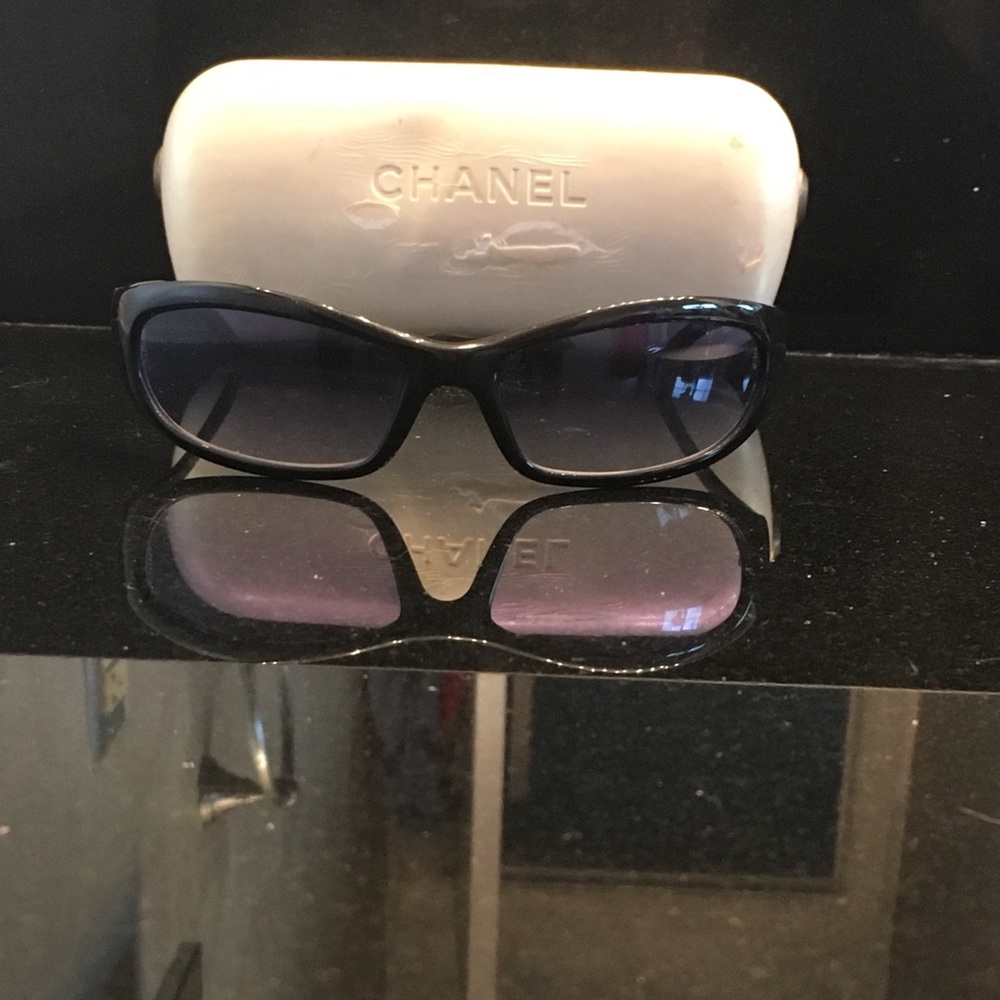Black CHANEL sunglasses with blue lenses